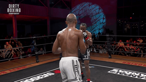 Two Boxers In A Boxing Ring With The Words Dirty Boxing Championship Above Them GIF