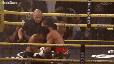Two Boxers In Ring With Social Gloves On Ropes GIF