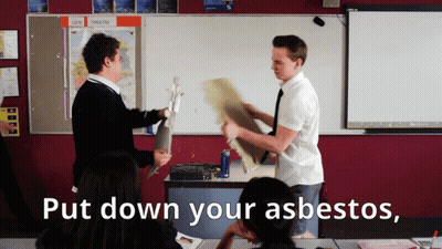 Two Boys Are Fighting In A Classroom With The Words Put Down Your Asbestos GIF