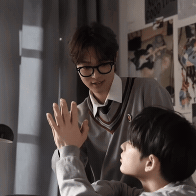 Two Boys Are Giving Each Other A High Five In Front Of A Poster That Says " No Good Times " GIF