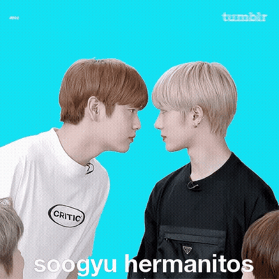Two Boys Are Looking At Each Other With The Words Soogyu Hermanitos Written On The Bottom GIF