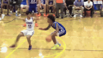 Two Boys Are Playing Basketball On A Court And One Is Wearing A Number 11 Jersey . GIF