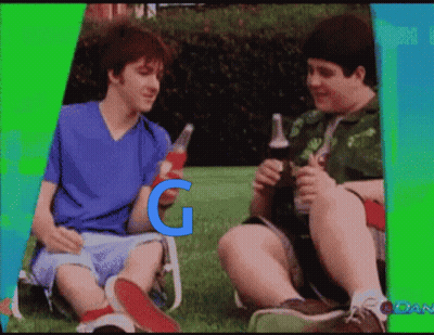 Two Boys Are Sitting In The Grass Holding Bottles Of Soda With The Letter G On The Bottom Right GIF
