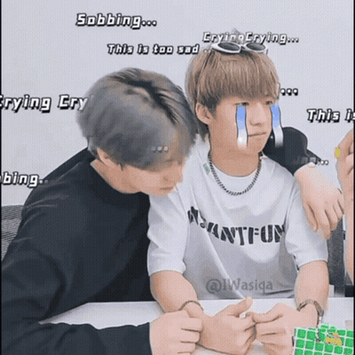 Two Boys Are Sitting Next To Each Other And One Has A Tear Coming Out Of His Eye GIF