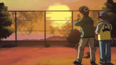 Two Boys Are Standing In Front Of A Fence And Watching The Sun Set GIF