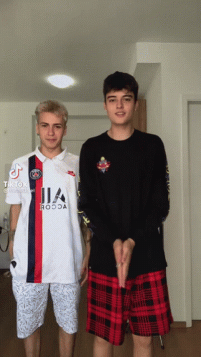 Two Boys Are Standing Next To Each Other And One Has A Shirt That Says ' Ia ' On It GIF