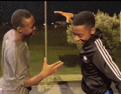 Two Boys Are Standing Next To Each Other And One Of Them Is Wearing A Black Adidas Jacket GIF