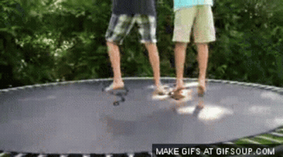 Two Boys Jumping On Trampoline GIF
