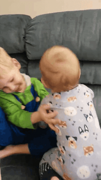 Two Boys Playing On Couch GIF