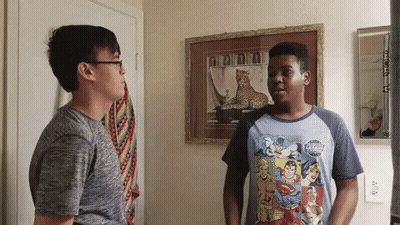 Two Boys Standing Before Leopard Picture GIF