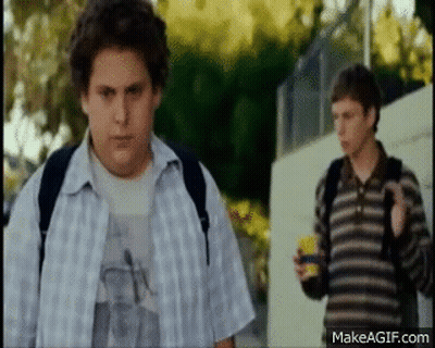 Two Boys Standing On Sidewalk GIF