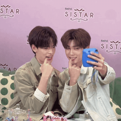 Two Boys Taking Selfie In Front Of Sistar Wall GIF