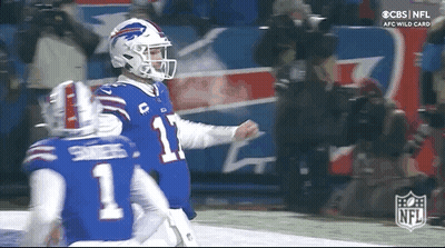 Two Buffalo Bills Players Are Celebrating A Touchdown During A Football Game . GIF