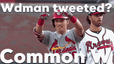 Two Cardinals Baseball Players Standing Next To Each Other GIF