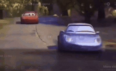 Two Cars Are Racing Down A Road In A Cartoon . GIF