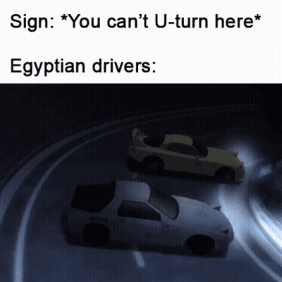 Two Cars Driving Down Road Sign You Can't U-Turn Here Egyptian Drivers GIF