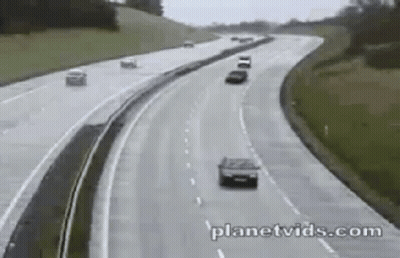 Two Cars Driving On Highway GIF