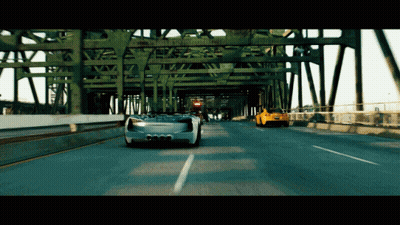 Two Cars Driving On Highway Under Bridge With Ambulance Sign GIF