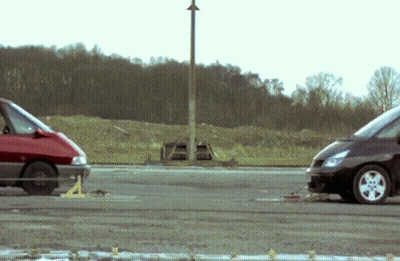 Two Cars Parked On Road GIF