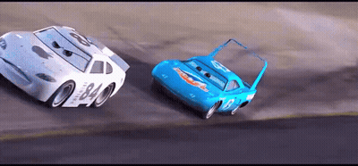 Two Cars Racing On Race Track GIF