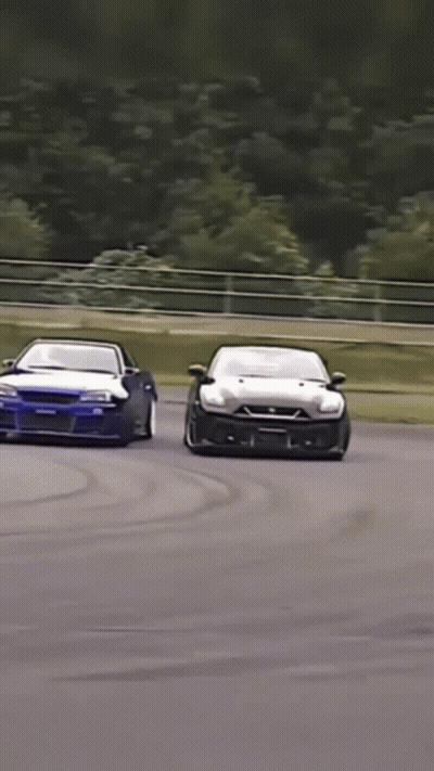 Two Cars Racing With Nissan Sticker GIF