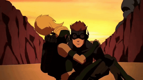 Two Cartoon Characters Are Hugging Each Other In Front Of A Mountain GIF