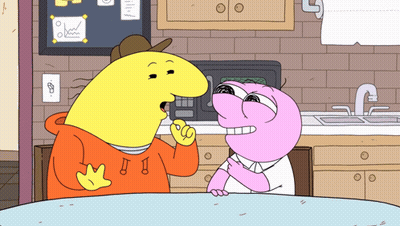 Two Cartoon Characters Are Sitting At A Table And One Has The Letter J On His Hoodie GIF