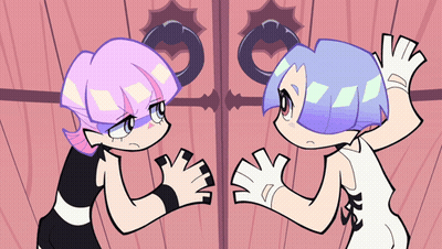 Two Cartoon Characters Are Standing Next To Each Other And One Of Them Has The Letter K On Her Shirt GIF