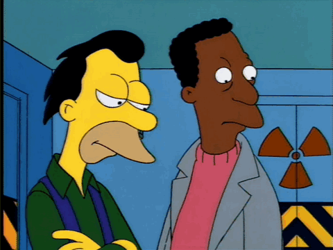 Two Cartoon Characters Are Standing Next To Each Other In Front Of A Nuclear Symbol GIF