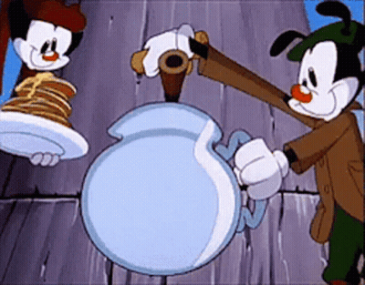 Two Cartoon Characters Are Standing Next To Each Other One Is Holding A Plate Of Pancakes GIF
