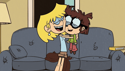 Two Cartoon Characters Hug On Couch GIF