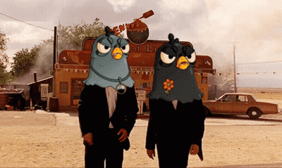 Two Cartoon Characters In Front Of Angry Birds Building GIF