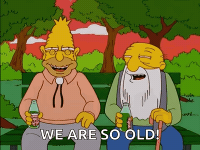 Two Cartoon Characters On Bench Holding Soda Saying We Are So Old GIF