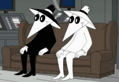 Two Cartoon Characters Sitting Crossed Legs GIF