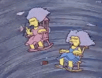 Two Cartoon Characters Sitting In Rocking Chairs In A Storm GIF