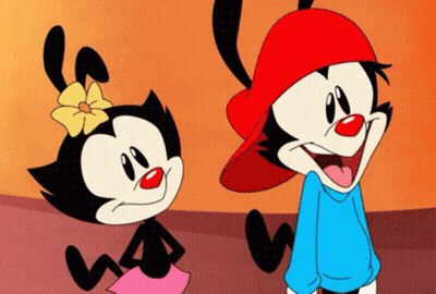 Two Cartoon Characters Standing And Smiling GIF