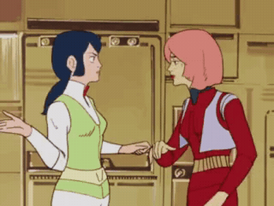 Two Cartoon Characters Standing Together GIF