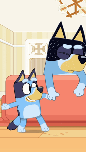 Two Cartoon Dogs Are Standing Next To Each Other On A Red Couch GIF