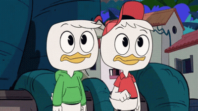 Two Cartoon Ducks Standing In Front Of House GIF