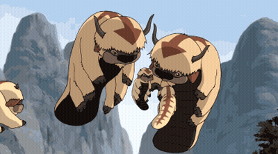 Two Cartoon Horned Animals On Mountain GIF