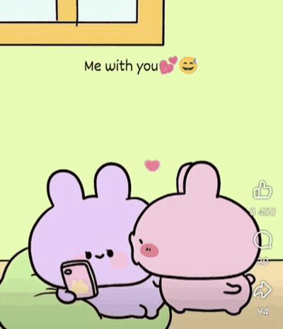 Two Cartoon Rabbits Sitting, One Holding Cell Phone GIF