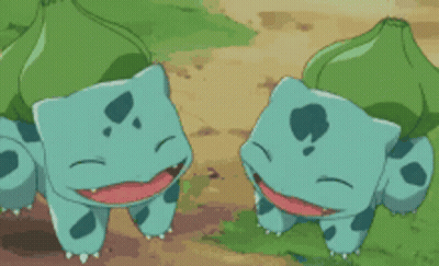 Two Cartoon Turtles Standing Together GIF