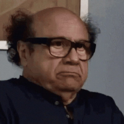 Two Cats In Reindeer Antlers Lying On Bed GIF