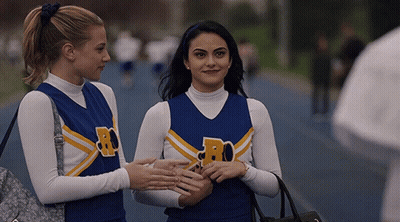 Two Cheerleaders With Letter R On Jersey GIF