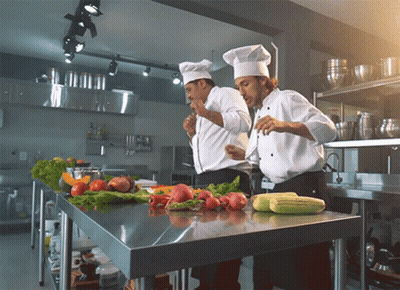 Two Chefs Preparing Food With Vegetables GIF