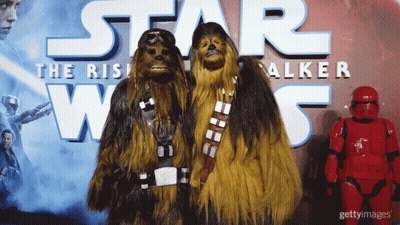 Two Chewbaccas In Front Of Star Wars Poster GIF