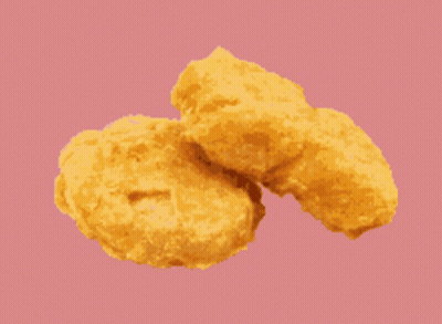 Two Chicken Nuggets On A Green Background GIF