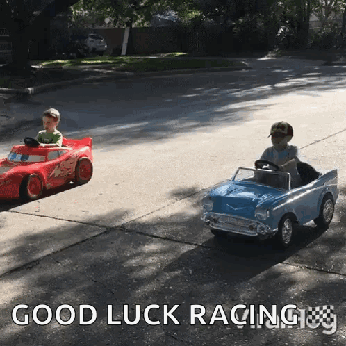 Two Children Are Driving Toy Cars On A Street With The Words Good Luck Racing GIF