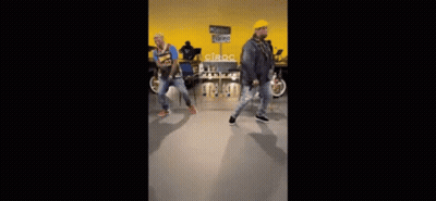 Two Children With Red Dreadlocks Pushing Shopping Cart GIF
