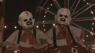 Two Clowns Standing In Front Of Ferris Wheel Insomniac GIF